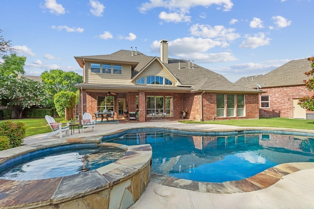 1709 Blair Ct, Carrollton, TX 75010 - view of swimming pool featuring a patio, a ceiling fan, a pool with connected hot tub, and a lawn