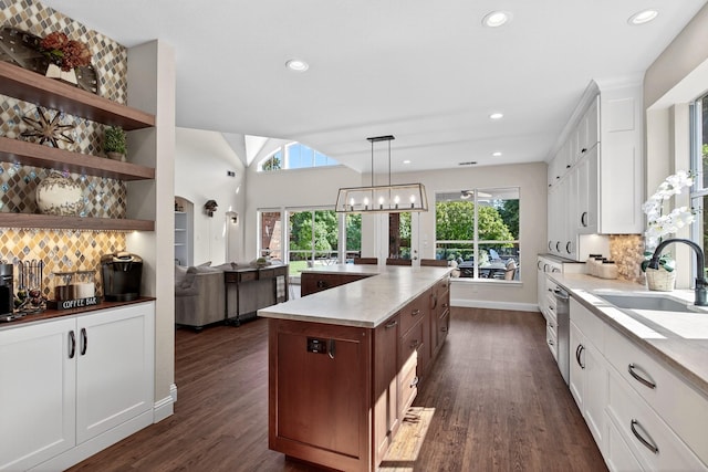 1709 Blair Ct, Carrollton, TX 75010 - kitchen with dark wood-style flooring, tasteful backsplash, white cabinets, and recessed lighting