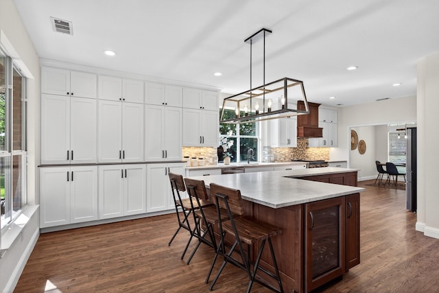 1709 Blair Ct, Carrollton, TX 75010 - kitchen with healthy amount of natural light, a center island, dark wood-style flooring, and recessed lighting