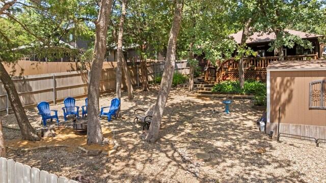 153 Bridlepath Dr, Pottsboro, TX 75076 - view of yard featuring a deck and an outdoor fire pit
