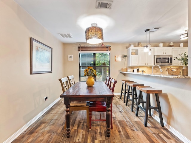 153 Bridlepath Dr, Pottsboro, TX 75076 - dining space featuring wood finished floors