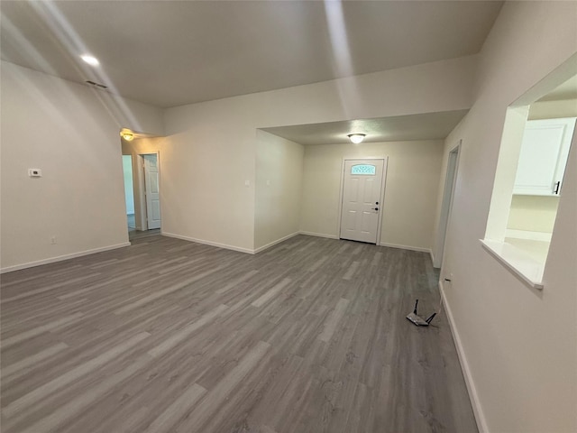 2703 Hollow Bnd, Mesquite, TX 75150 - unfurnished living room with wood finished floors and baseboards