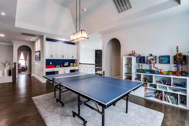 840 Redstem Dr, Prosper, TX 75078 - game room with arched walkways, dark wood-style floors, and recessed lighting