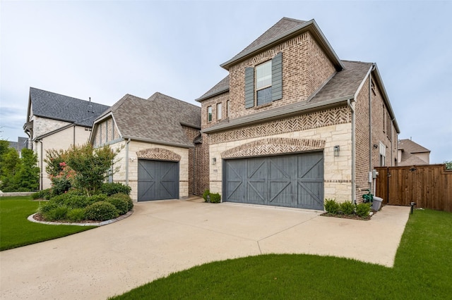 840 Redstem Dr, Prosper, TX 75078 - french country home with roof with shingles, brick siding, stone siding, and concrete driveway