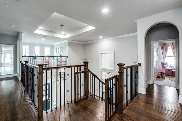 840 Redstem Dr, Prosper, TX 75078 - hall with an upstairs landing, wood finished floors, recessed lighting, a raised ceiling, and ornamental molding