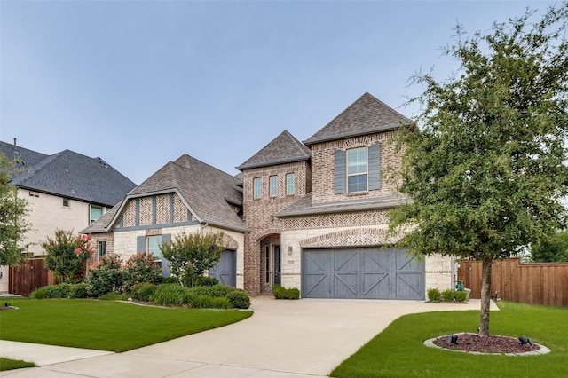840 Redstem Dr, Prosper, TX 75078 - french country inspired facade featuring driveway, brick siding, a shingled roof, and an attached garage