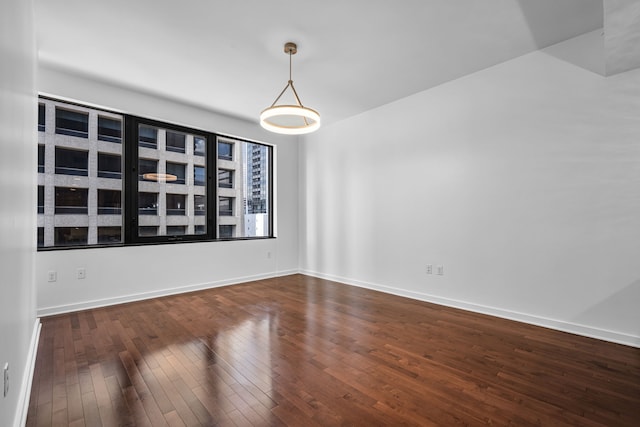 1200 Main St Unit 707, Dallas, TX 75202 - empty room featuring dark wood finished floors and baseboards