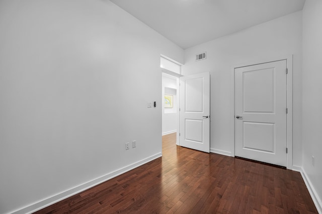 1200 Main St Unit 707, Dallas, TX 75202 - unfurnished bedroom with dark wood-type flooring and baseboards