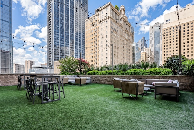 1200 Main St Unit 707, Dallas, TX 75202 - view of green lawn with an outdoor hangout area and a view of city
