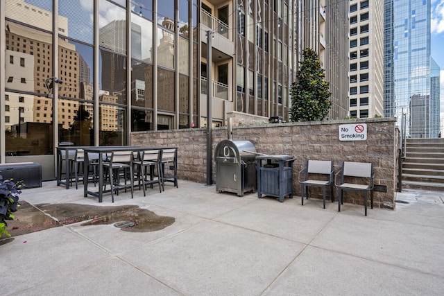1200 Main St Unit 707, Dallas, TX 75202 - view of patio featuring a grill