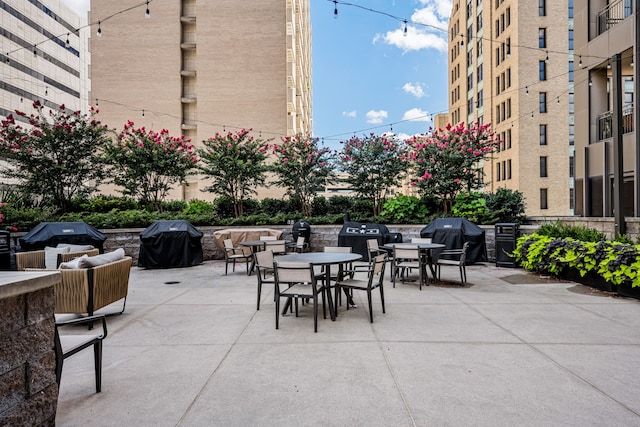 1200 Main St Unit 707, Dallas, TX 75202 - view of patio / terrace featuring grilling area and outdoor dining area