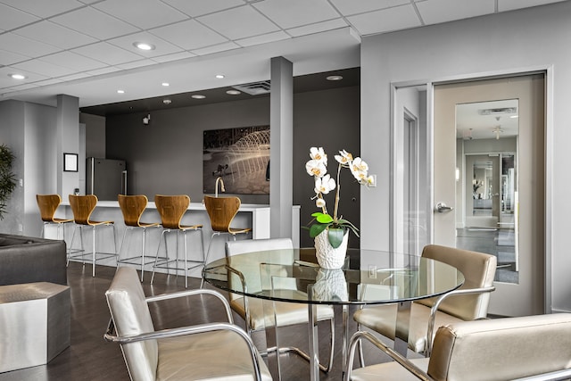 1200 Main St Unit 707, Dallas, TX 75202 - dining space featuring a drop ceiling, recessed lighting, and wood finished floors