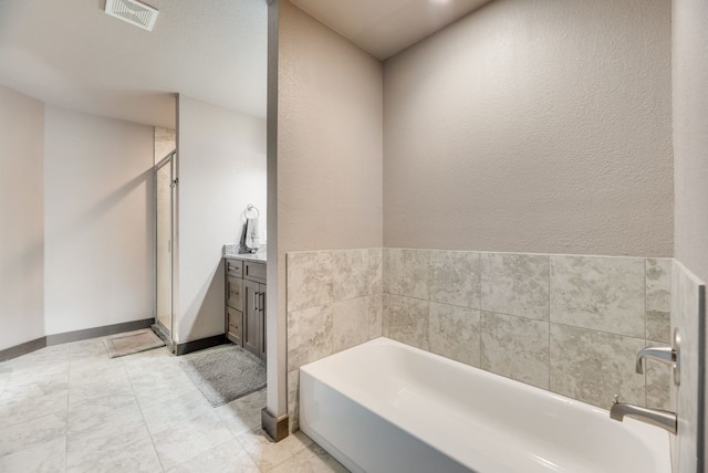 421 W Holford St, Pilot Point, TX 76258 - full bath featuring a garden tub, a shower stall, and vanity
