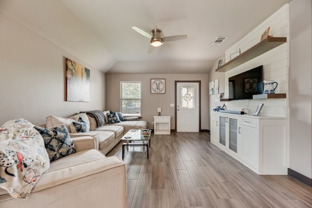 421 W Holford St, Pilot Point, TX 76258 - living area featuring light wood finished floors, a ceiling fan, and vaulted ceiling