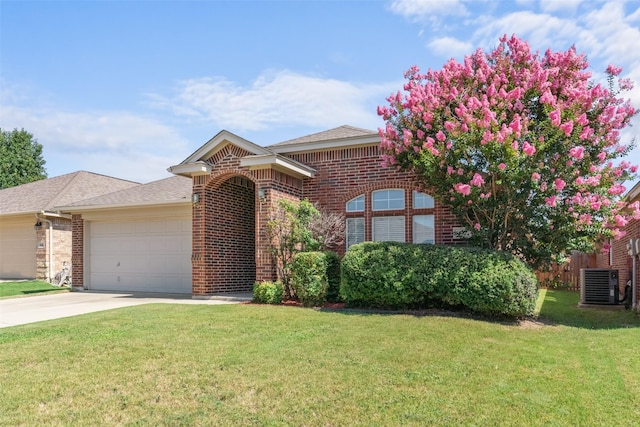 842 Randall Rd, Weatherford, TX 76087 - view of front of house with brick siding, an attached garage, driveway, and a shingled roof