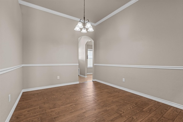 842 Randall Rd, Weatherford, TX 76087 - empty room featuring arched walkways, wood finished floors, ornamental molding, and a chandelier