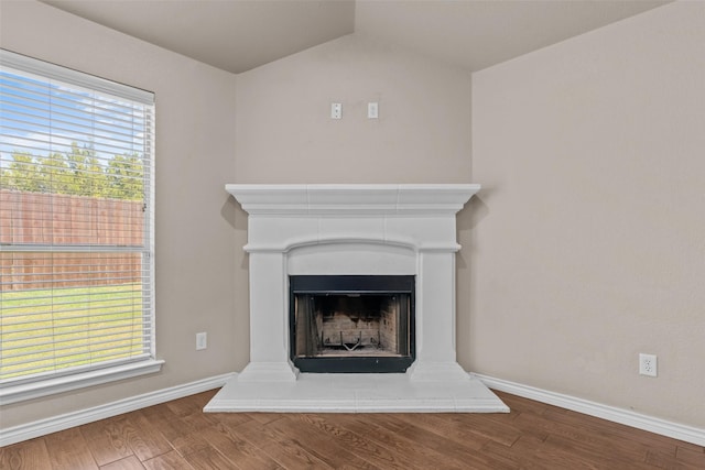 842 Randall Rd, Weatherford, TX 76087 - detailed view of wood finished floors and a fireplace with raised hearth