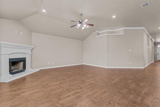 842 Randall Rd, Weatherford, TX 76087 - unfurnished living room with a ceiling fan, lofted ceiling, recessed lighting, wood finished floors, and a fireplace with raised hearth
