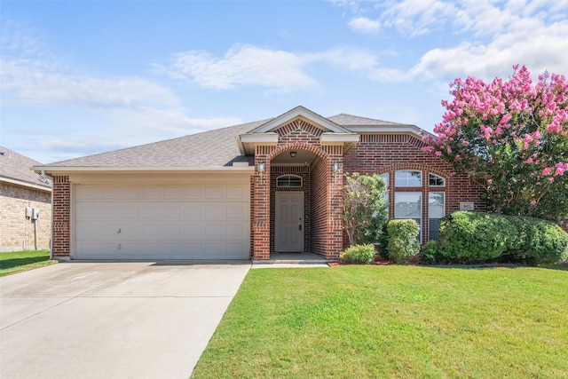 842 Randall Rd, Weatherford, TX 76087 - view of front of house with brick siding, driveway, a front lawn, and a garage