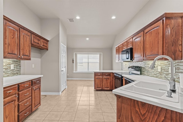 842 Randall Rd, Weatherford, TX 76087 - kitchen featuring black appliances, tasteful backsplash, light countertops, a peninsula, and recessed lighting