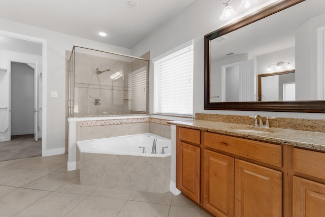 4560 Cheetah Trl, Frisco, TX 75034 - full bath with tile patterned flooring, vanity, a shower stall, a garden tub, and recessed lighting