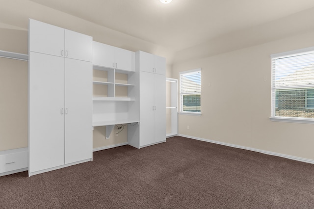4560 Cheetah Trl, Frisco, TX 75034 - unfurnished bedroom featuring dark colored carpet and baseboards