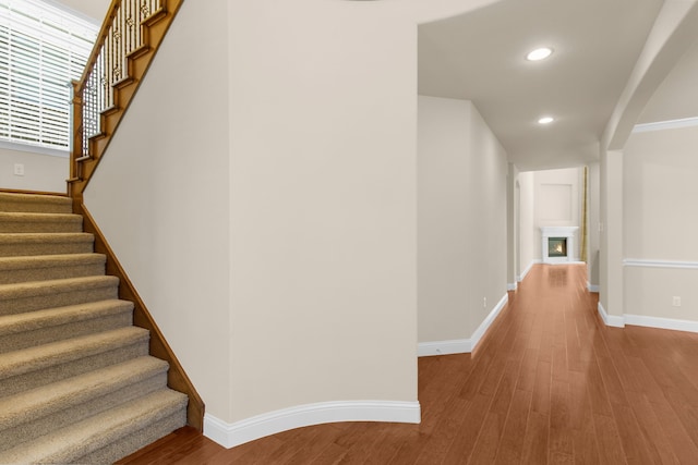 4560 Cheetah Trl, Frisco, TX 75034 - hall featuring stairs, wood finished floors, and recessed lighting