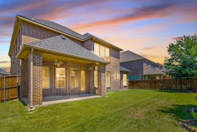 4560 Cheetah Trl, Frisco, TX 75034 - rear view of house with brick siding, a fenced backyard, a shingled roof, and a patio area