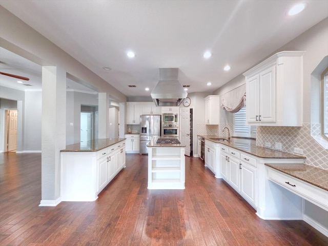 4348 Rice Ln, Carrollton, TX 75010 - kitchen with appliances with stainless steel finishes, dark wood-style flooring, white cabinetry, and recessed lighting
