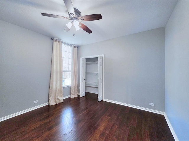 4348 Rice Ln, Carrollton, TX 75010 - unfurnished bedroom with wood finished floors, a closet, and a ceiling fan