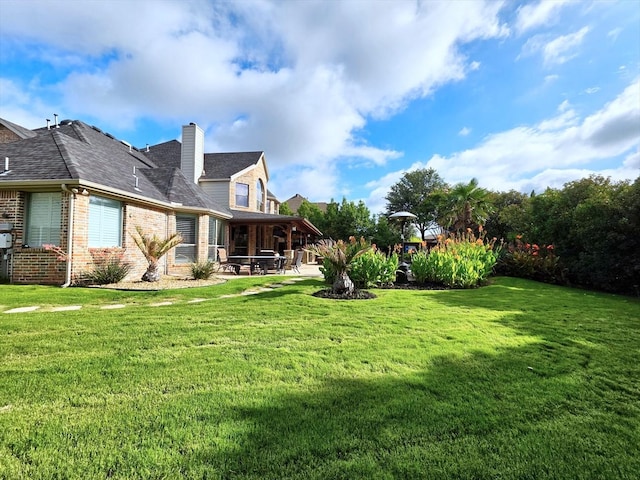 4348 Rice Ln, Carrollton, TX 75010 - view of grassy yard featuring a patio area