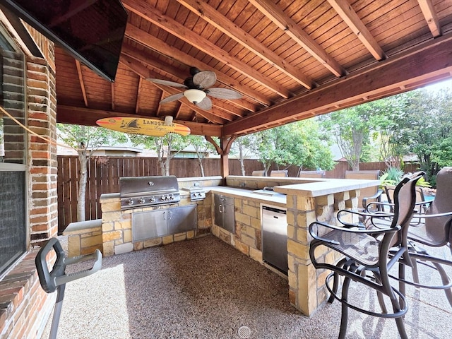 4348 Rice Ln, Carrollton, TX 75010 - fenced backyard featuring area for grilling and ceiling fan