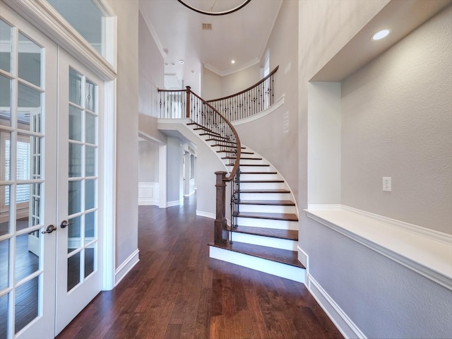 4348 Rice Ln, Carrollton, TX 75010 - stairway with wood finished floors, french doors, ornamental molding, and a high ceiling