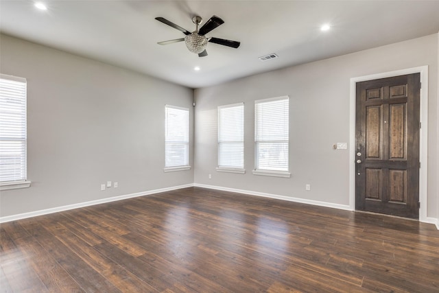619 Buckalew St, Dallas, TX 75208 - empty room featuring a ceiling fan, dark wood-type flooring, and recessed lighting