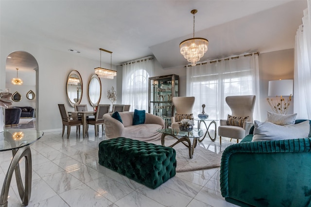 1400 Ambrose Dr, Allen, TX 75002 - living room with a chandelier, arched walkways, and marble finish flooring