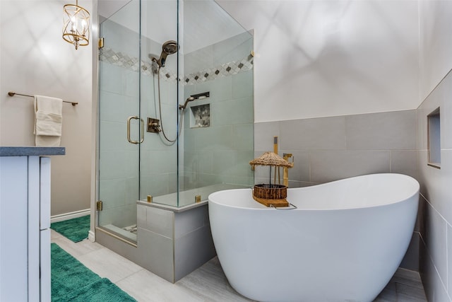 1400 Ambrose Dr, Allen, TX 75002 - full bathroom featuring a shower stall, tile walls, a freestanding bath, and tile patterned floors
