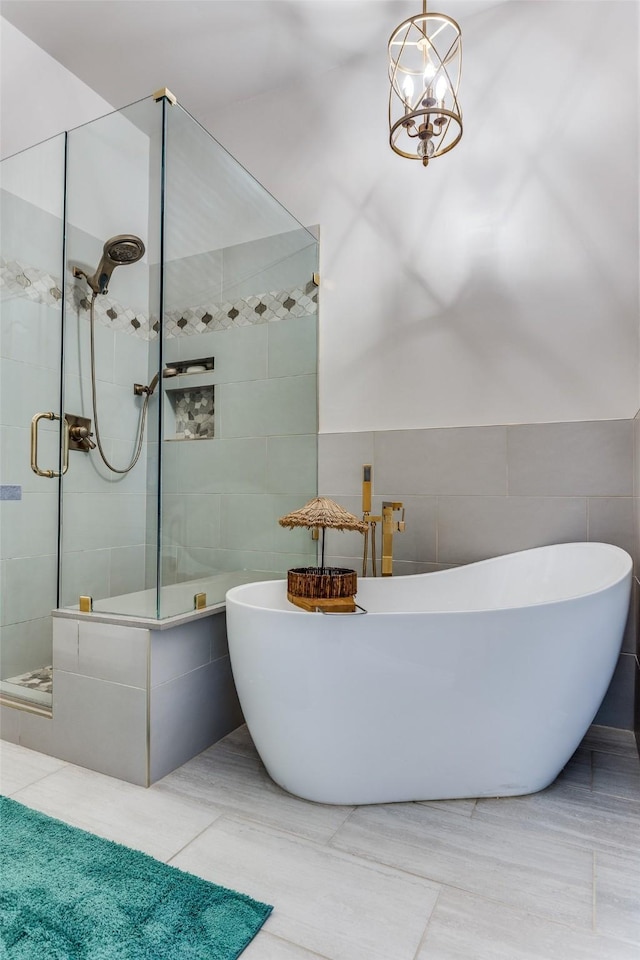 1400 Ambrose Dr, Allen, TX 75002 - bathroom with tile walls, a stall shower, and a freestanding tub