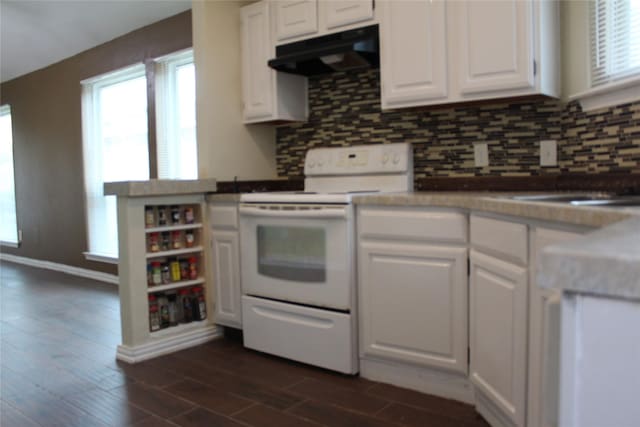 1108 Paintbrush St, Mesquite, TX 75149 - kitchen with white electric range, exhaust hood, white cabinetry, and plenty of natural light