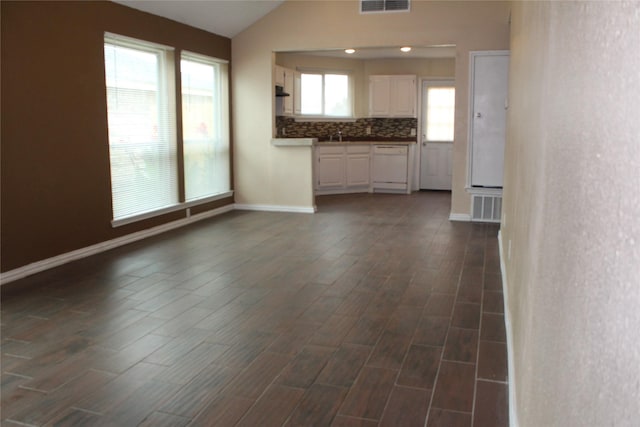 1108 Paintbrush St, Mesquite, TX 75149 - unfurnished living room featuring vaulted ceiling and dark wood-type flooring