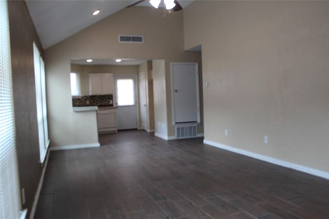 1108 Paintbrush St, Mesquite, TX 75149 - unfurnished living room with ceiling fan, dark wood-style flooring, and high vaulted ceiling