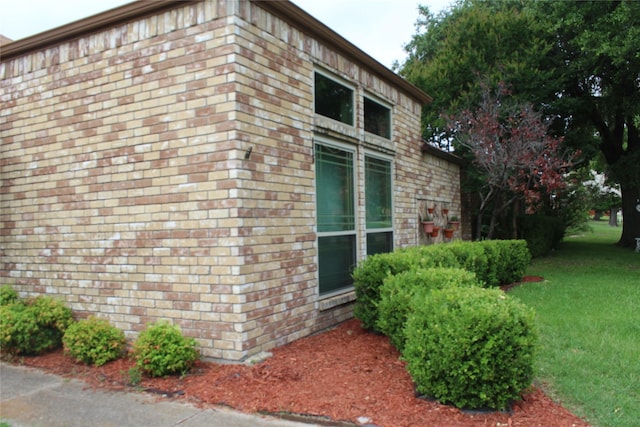 1108 Paintbrush St, Mesquite, TX 75149 - view of side of home featuring a lawn and brick siding