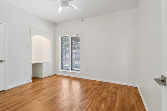 10754 Villager Rd Unit D, Dallas, TX 75230 - spare room featuring light wood-style flooring and a ceiling fan