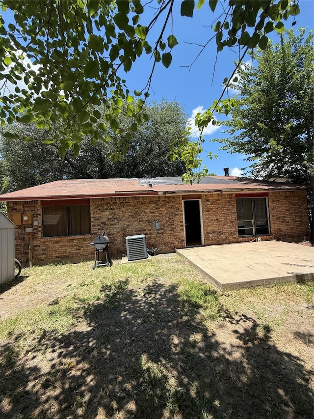 5918 Highcrest Dr, Garland, TX 75043 - back of property with a patio area and brick siding