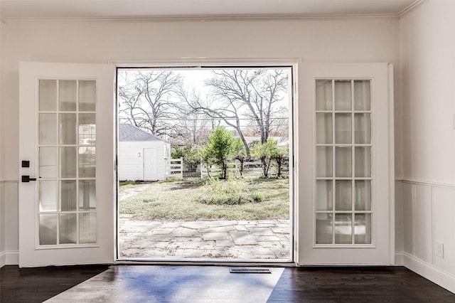 3601 Westcliff Rd S, Fort Worth, TX 76109 - entryway with ornamental molding, wood finished floors, and a wainscoted wall
