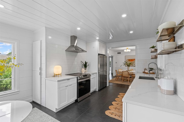 3601 Westcliff Rd S, Fort Worth, TX 76109 - kitchen with wall chimney exhaust hood, appliances with stainless steel finishes, open shelves, recessed lighting, and healthy amount of natural light