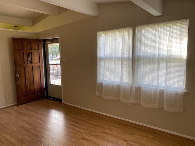 112 Jenny Kay Ln, Irving, TX 75060 - foyer featuring wood finished floors and beam ceiling