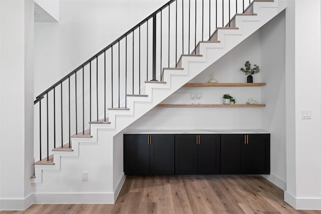2828 Rochester St, Dallas, TX 75215 - staircase with baseboards and wood finished floors