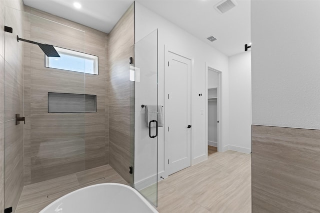 2828 Rochester St, Dallas, TX 75215 - bathroom featuring a stall shower and a freestanding bath
