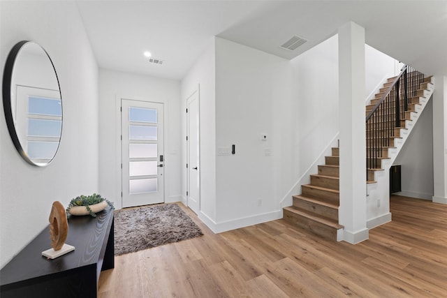 2828 Rochester St, Dallas, TX 75215 - foyer entrance with stairs, wood finished floors, and recessed lighting