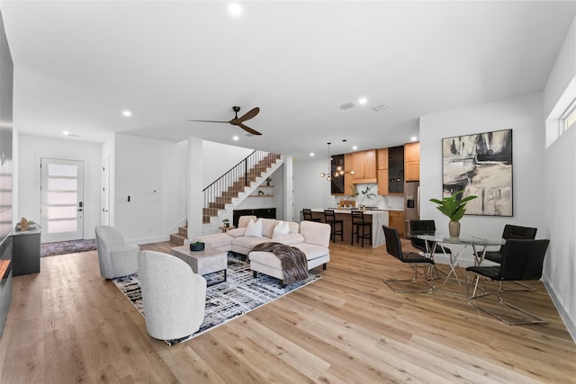 2828 Rochester St, Dallas, TX 75215 - living area with stairway, light wood-style floors, recessed lighting, and ceiling fan